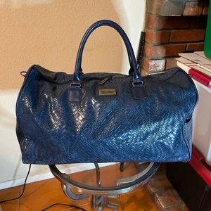 Nicole Miller blue leather travel bag